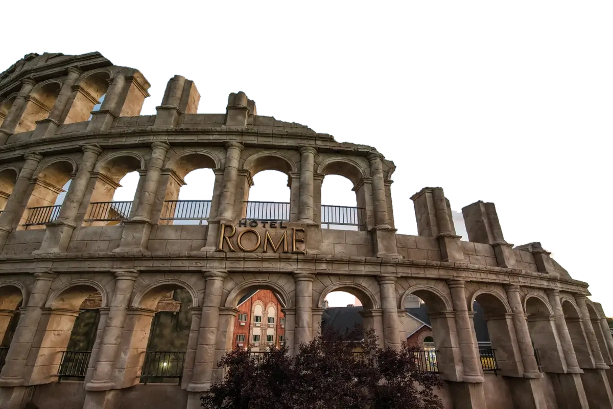 Hotel Rome's columned entrance at Mt. Olympus Resort at dusk