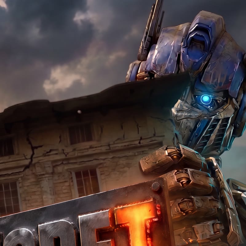 A giant metal robot peeks around the corner of the building above the glowing welded T